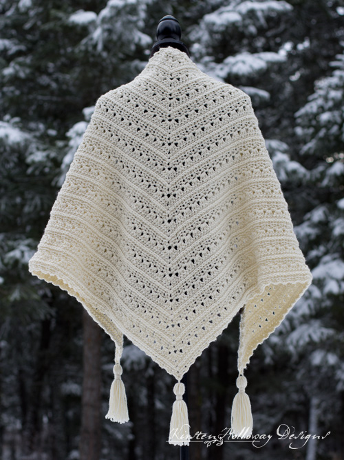 The classic triangle shape and lacy stitches make the Primrose and Proper shawl pattern a quick, easy and, beautiful project to dress up your wardrobe this winter.
