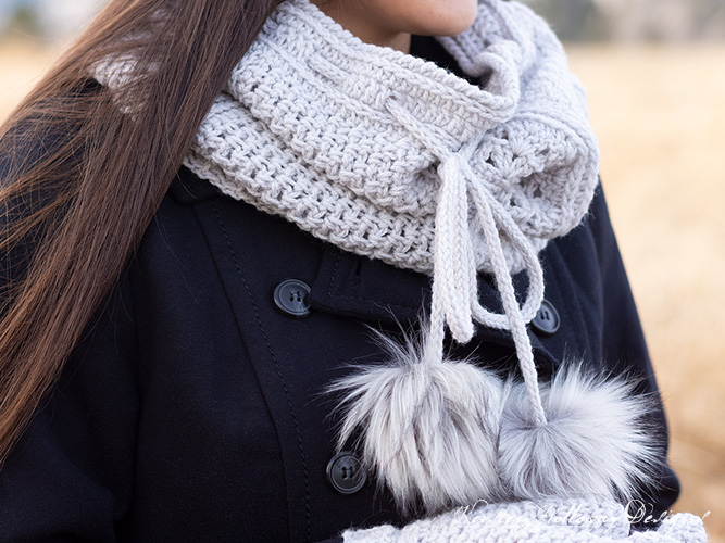 The Misty Hollow cowl features pom-poms and easy crochet stitches used in new ways.