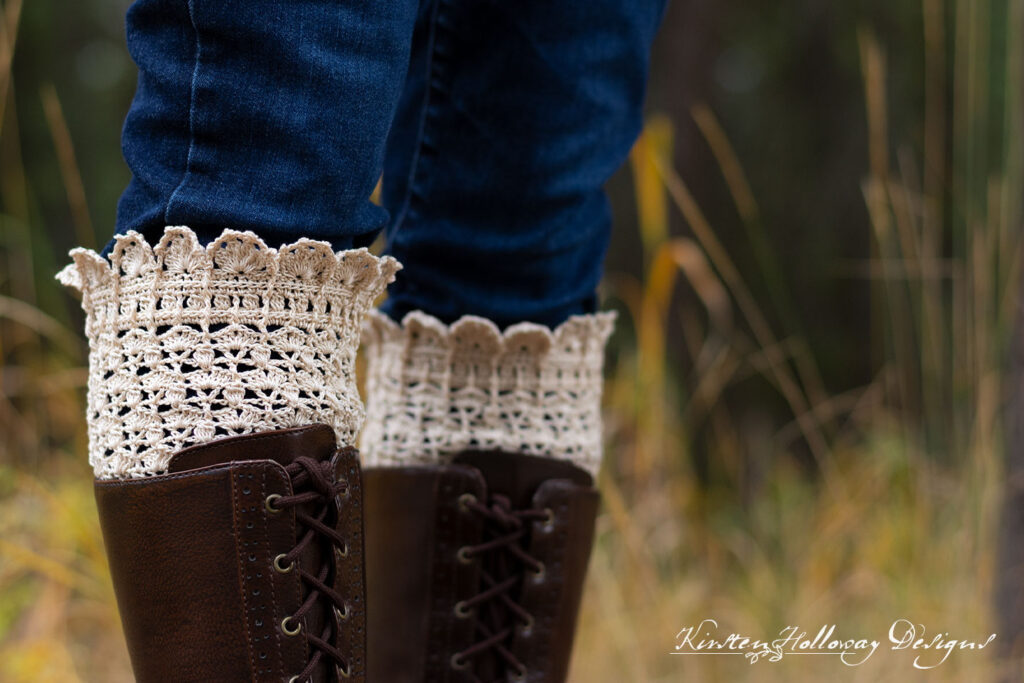Close-up of off-white lacy crochet boot cuffs showing stitch details.