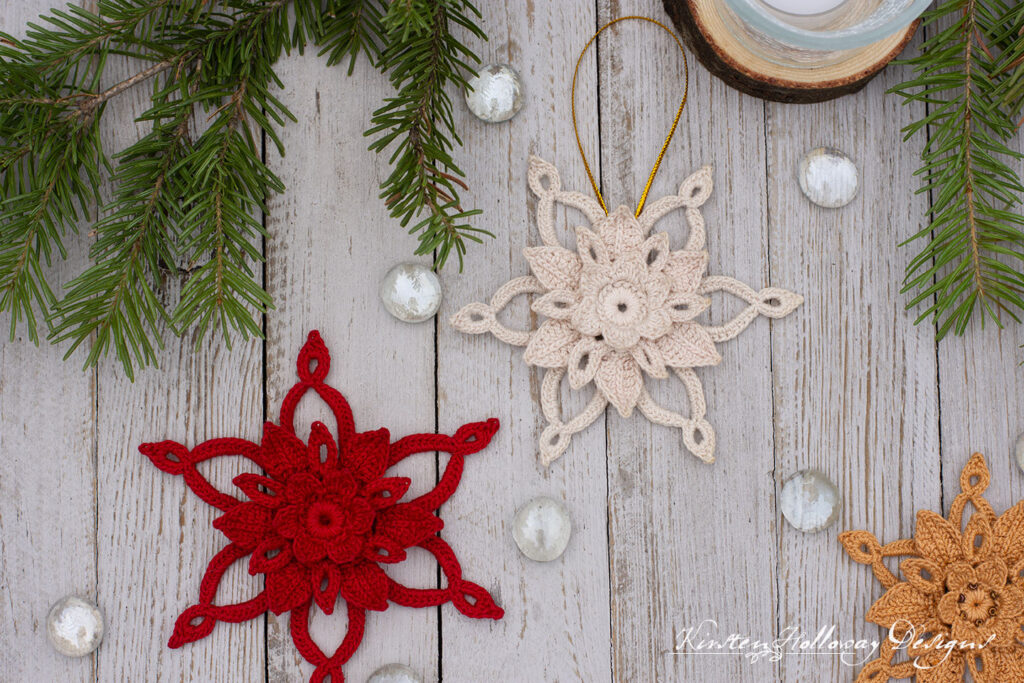 Pretty poinsettia ornaments on a wood background. Crochet them for your tree, to add to gifts, or as a hair clip!